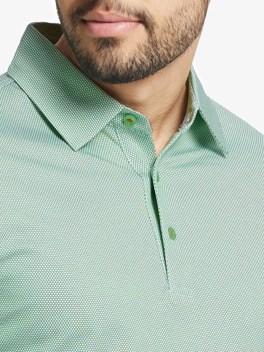 Close-up front view from nose to chest wearing EMERALD Performance Ananas Jacquard Polo