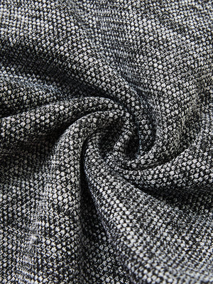 Close-up fabric detail of soft sweatpants with 4 zipper pockets, smooth texture and cozy black heather feel