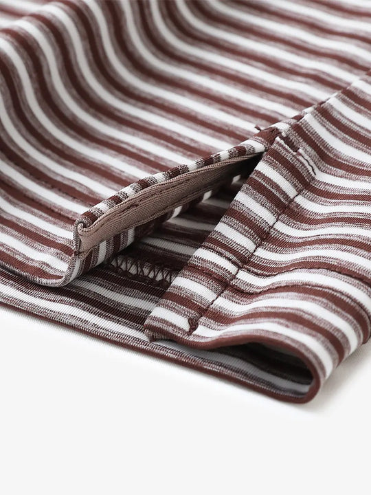 Close-up detail of hem opening on Sport Fit Stripe Polo in Brown Stripe