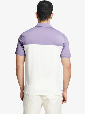 Back half-body view wearing CREAM Premium Performance Polo