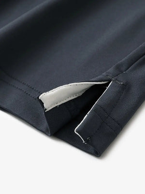 Close-up of hem slit detail in DARK GREY Premium Performance Polo
