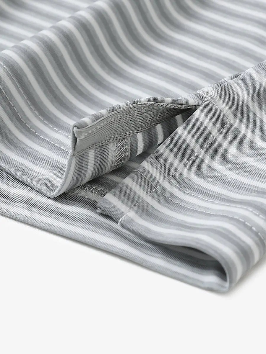 Close-up detail of hem opening on Sport Fit Stripe Polo in Grey White Stripe