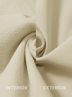 Fabric close-up of reflective hooded softshell jacket, showing texture and finish in light khaki.