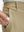 Detail shot of the side pocket on the khaki youth water resistant cotton blend golf pants, showing functionality