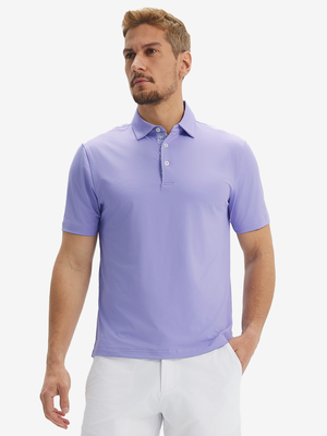 Front half-body view of a model wearing the lilac everyday classic solid polo, displaying the chest pocket detail
