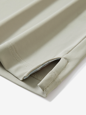 Detail of the side vent hem on the oyster gray everyday classic solid polo, showing the split hem feature