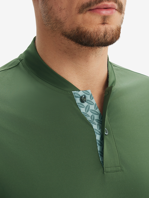 Close-up of model in  army green moisture-wicking short sleeve henley shirt, nose to chest front view.