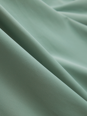 Close-up of grey green Moisture-Wicking Short Sleeve Henley Shirt fabric texture.