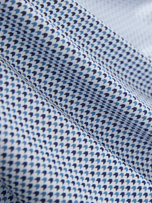 Close-up of light dark blue graphics lightweight stretch upgraded print golf polo shirts, showcasing texture and print details.