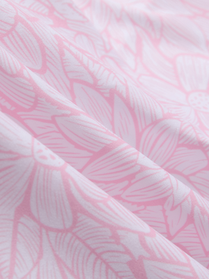 Close-up of pink artichoke lightweight stretch upgraded print golf polo shirts, showcasing texture and print details.