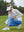 Woman adjusting ankle zip on Women's Ultra-stretch Quick Dry Sweatpants with Ankle Zips in misty blue on golf course
