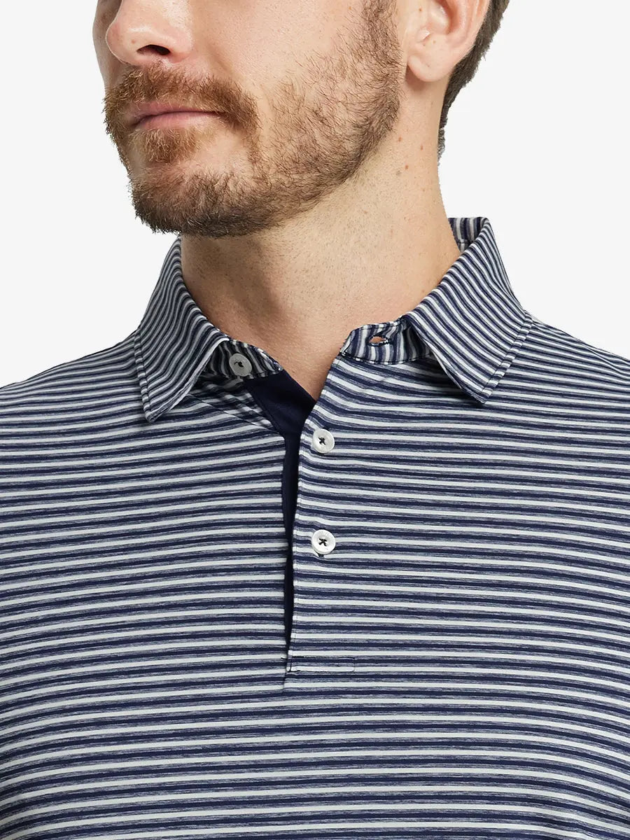 Front close-up shot of model from nose to chest wearing Sport Fit Stripe Polo in Navy Stripe