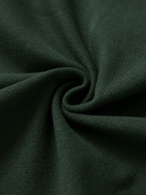 Fabric close-up of forest green women's water-resistant stretch fleece lined jacket, soft stretch fabric with fleece lining.