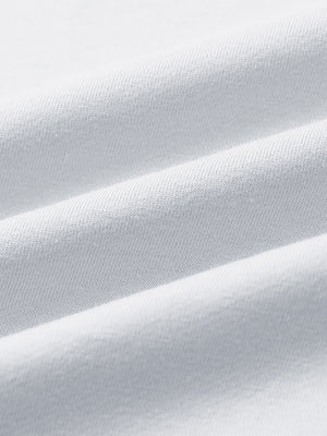 Close-up of fabric on 2 in 1 running sports shorts with liner, showing texture and finish in white