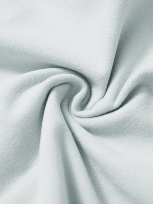 Fabric close-up of misty grey water resistant comfy fleece golf joggers, soft fleece texture with water-resistant finish.